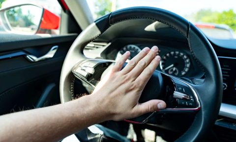 Someone pressing a car horn